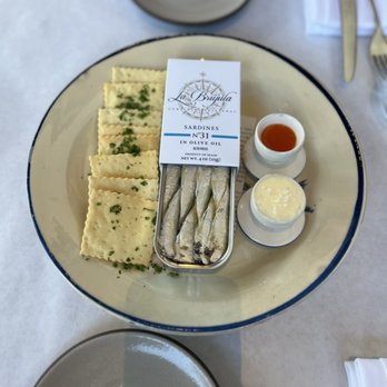 Bell's - la brújula tinned sardines: house-made saltines, cultured butter smeared+ priedite hot sauce = $23 - French Near Me - Los Alamos, California