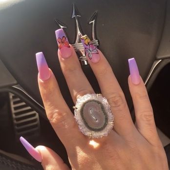 Aura Beauty - Her butterfly is hand drawn to perfection - Nail Salons Near Me - Weston, Florida Aura Beauty - Her butterfly is hand drawn to perfection - Nail Salons Near Me - Weston, Florida