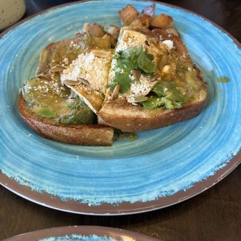 Atticus Cafe - Avocado toast with egg, cilantro, and green salsa - Breakfast & Brunch Near Me - Anaheim, California Atticus Cafe - Avocado toast with egg, cilantro, and green salsa - Breakfast & Brunch Near Me - Anaheim, California