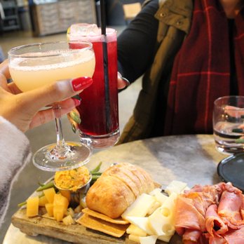 Whiskey Kitchen - Cheers to friendship - Southern Near Me - Raleigh, North Carolina