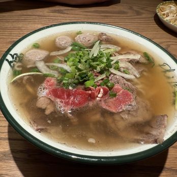 Pho Le - Signature pho with raw beef, brisket, and meatballs. The chili sauce was a great addition. - Vietnamese Near Me - Richmond Hill, Ontario