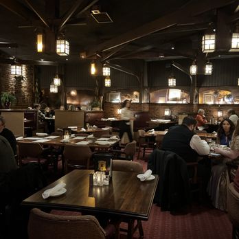 Copper Cellar West - people sitting at tables in a dimly lit restaurant - Steakhouses Near Me - Knoxville, Tennessee