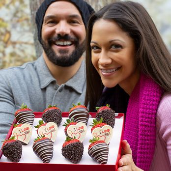 Edible Arrangements - a man and woman holding a box of chocolate covered strawberries - Gift Shops Near Me - Mount Laurel, New Jersey Edible Arrangements - a man and woman holding a box of chocolate covered strawberries - Gift Shops Near Me - Mount Laurel, New Jersey