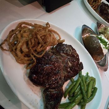 Bern's Steak House - 14oz Dry aged Delmonico with onion rings and green beans - Steakhouses Near Me - Tampa, Florida Bern's Steak House - 14oz Dry aged Delmonico with onion rings and green beans - Steakhouses Near Me - Tampa, Florida