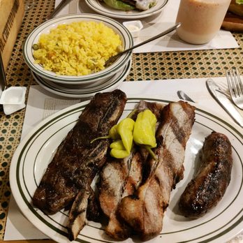 El Chivito D’ Oro - Combo 4 (short rib, sausage, skirt steak) with yellow rice with vegetable - Latin American Near Me - Jackson Heights, New York