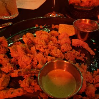 George’s Bistro & Bar - Fried calamari (front) and parmesan truffle fries (back) - Pizza Near Me - Houston, Texas George’s Bistro & Bar - Fried calamari (front) and parmesan truffle fries (back) - Pizza Near Me - Houston, Texas