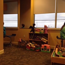 Stephen M Sherwood DDS PLLC - More toys & books, plus the Pacman table on the right & a nook with both PS and Xbox games on the left.