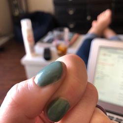J & J Nails & Spa - Top coat got on my skin and essentially glued the nail to my skin