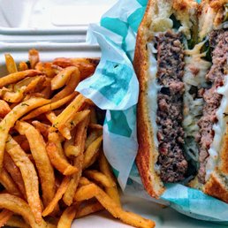 Philly Cheese Patty Melt - Impossible Patty, Charred Peppers & Onions, Mozzarella, Mayo, Mustard, Toasted Bread. Served with fries.