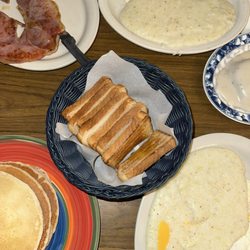 Toast Fried eggs  3 Buttermilk Hotcakes with Country Ham Cheese grits  Biscuits and gravy