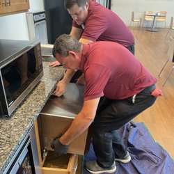 Jacks and Jill Appliance Rx - Joseph and Mack installing some microwaves for a factory's employee break room.