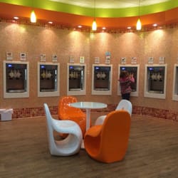 Orange Leaf Frozen Yogurt - The wall of Yogurt.
