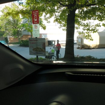 Chick-fil-A - ows a person riding a bike in the street - Fast Food Near Me - Cincinnati, Ohio