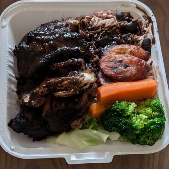 Chris Jerk - Jerk chicken quarter leg with jerk gravy, with steamed veggies, and basmati rice and peas. BOGO on DoorDash. - Caribbean Near Me - Markham, Ontario