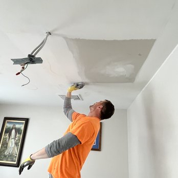 wal contracting - a man working on a ceiling - General Contractors Near Me wal contracting - a man working on a ceiling - General Contractors Near Me
