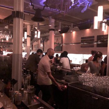 Philemon Bar - people sitting at the bar - Wine Bars Near Me - Montreal, Quebec