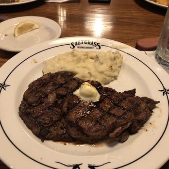 Saltgrass Steak House - Ribeye steak (server thumb smudge in corner) - Steakhouses Near Me - Branson, Missouri