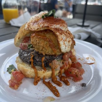 Vicious Biscuit - The Ranchero- cheddar & jalapeño biscuit, black bean spread, panko-crusted avocado, pico de gallo, spicy remoulade, sunny side egg - Breakfast & Brunch Near Me - Neptune Beach, Florida
