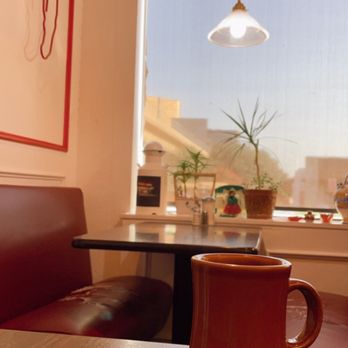 Oasis Restaurant - a cup of coffee on a table - Breakfast & Brunch Near Me - Dallas, Texas