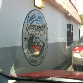 Taco John's - a view of a car parked in front of a restaurant - Mexican Near Me - Duluth, Minnesota Taco John's - a view of a car parked in front of a restaurant - Mexican Near Me - Duluth, Minnesota