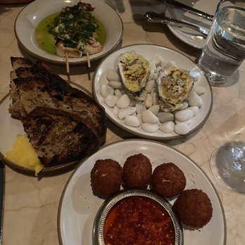 Dame - Grilled oysters with green chartreuse hollandaise, squid and scallion skewer, smoked whitefish croquettes, and bread. - Seafood Near Me - New York, New York