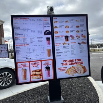 Dunkin' - a menu and a car in a parking lot - Donuts Near Me - New Albany, Ohio Dunkin' - a menu and a car in a parking lot - Donuts Near Me - New Albany, Ohio
