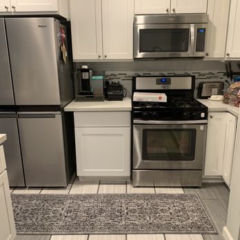 Save The Day Restoration - After: repaired kitchen drywall, cabinet, & flooring - Damage Restoration Near Me - Signal Hill, California Save The Day Restoration - After: repaired kitchen drywall, cabinet, & flooring - Damage Restoration Near Me - Signal Hill, California
