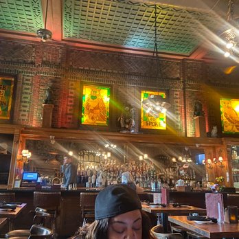 The Owl Bar - a woman sitting at a table - Bars Near Me - Baltimore, Maryland