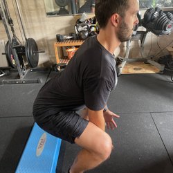 Upstanding Care Chiropractic - Tyler pictured working on neuromuscular re-education