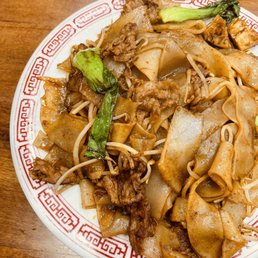a plate of noodles and meat a plate of noodles and meat
