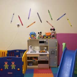 Social Butterflies Daycare - One of two play rooms that encourage pretend play, sensory input, movement and exploration.