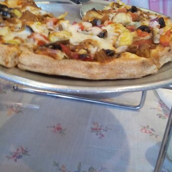 Ale Pie House - They call it Pesto Pie. It's got pesto, goat cheese, pineapple, olives... - Italian Near Me - Orange Park, Florida Ale Pie House - They call it Pesto Pie. It's got pesto, goat cheese, pineapple, olives... - Italian Near Me - Orange Park, Florida
