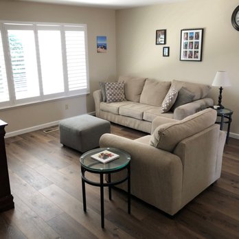 FloorPro - a living room with hardwood floors - Flooring Near Me
