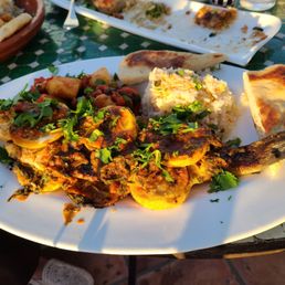 Branzino with Moroccan spices and oven baked bread, and targine stew.