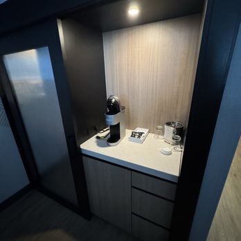 Cambria Hotel Spokane Airport - Coffee/tea and mini fridge. Closet to the left. - Hotels Near Me - Spokane, Washington