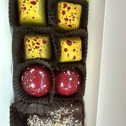 Norman Love Confections - Fort Myers - Peanut butter and jelly, raspberry and coconut and milk chocolate almond bar