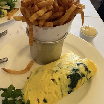 The Odeon - My spinach, Gruyere, and onion omelette with fries - New American Near Me - New York, New York The Odeon - My spinach, Gruyere, and onion omelette with fries - New American Near Me - New York, New York