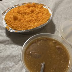La Cocina Dominicana - Orange rice that's supposed to be yellow rice and watery, bland, and no flavor beans.