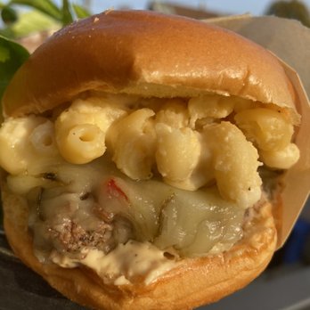 Cuisines by Sammy - House made mac and cheese on top of pepperjack cheese, on top of a house made patty, in between a brioche bun. - Food Delivery Services Near Me - Chicago, Illinois