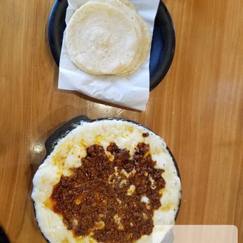 El Fogon - a table with two pizzas on it - Tacos Near Me - Brownsville, Texas El Fogon - a table with two pizzas on it - Tacos Near Me - Brownsville, Texas
