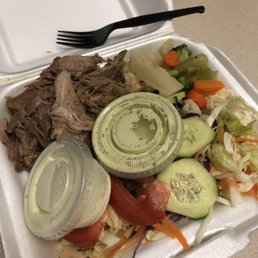 Roasted Pork Combo Pernil with salad and sautéed veggies, side of garlic sauce and hot sauce Roasted Pork Combo Pernil with salad and sautéed veggies, side of garlic sauce and hot sauce