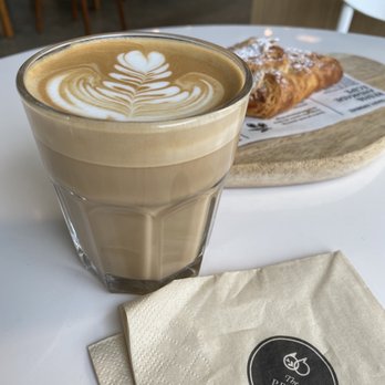 The Press Room - Flat white and almond croissant. - Bakeries Near Me - Vancouver, British Columbia The Press Room - Flat white and almond croissant. - Bakeries Near Me - Vancouver, British Columbia