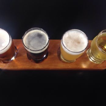 Beer BBQ Shop - Four beer flight. (Left to right: Brooklyn lager, Missouri Beer Co. dark mild, 4hands superflare, and Leaky Roof Meadery dusty mead.) - Barbeque Near Me - St. Peters, Missouri Beer BBQ Shop - Four beer flight. (Left to right: Brooklyn lager, Missouri Beer Co. dark mild, 4hands superflare, and Leaky Roof Meadery dusty mead.) - Barbeque Near Me - St. Peters, Missouri