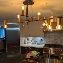 AquaBella Kitchen Bath & Lighting Showroom - Kitchen chandelier really makes the room.