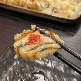 Jino Asian Delight - chopsticks holding a piece of food - Japanese Near Me - Estevan, Saskatchewan Jino Asian Delight - chopsticks holding a piece of food - Japanese Near Me - Estevan, Saskatchewan