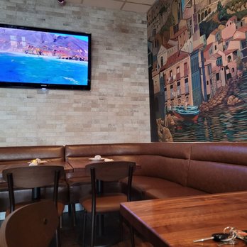 Renato's - An updated corner with new wall bench. - Pizza Near Me - Westminster, California
