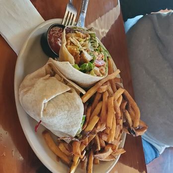 Train Wreck Bar - Crispy chicken wrap with house cut fries. - Sports Bars Near Me - Burlington, Washington Train Wreck Bar - Crispy chicken wrap with house cut fries. - Sports Bars Near Me - Burlington, Washington