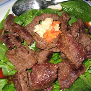 Lan Pan Asian Cafe - garlic beef tataki -- skirt steak over spinach in a soy broth. Topped with crushed garlic and chili-daikon. - Pan Asian Near Me - Miami, Florida Lan Pan Asian Cafe - garlic beef tataki -- skirt steak over spinach in a soy broth. Topped with crushed garlic and chili-daikon. - Pan Asian Near Me - Miami, Florida
