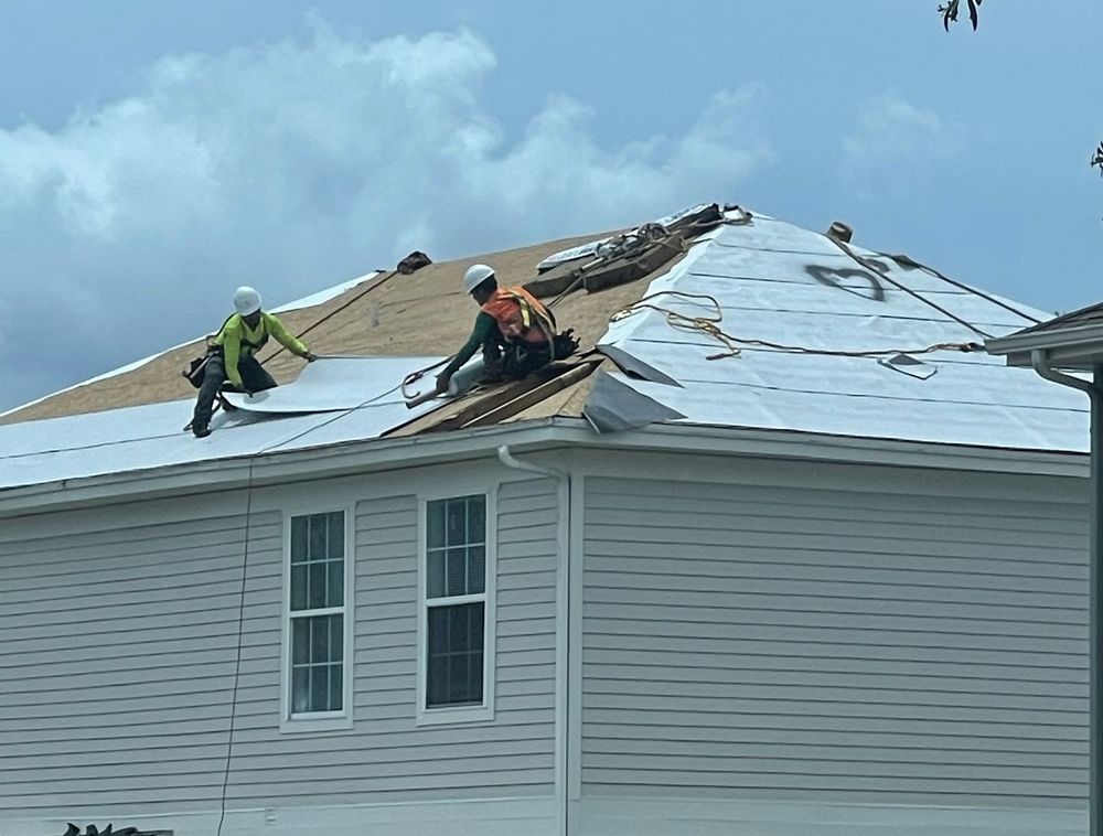 Slide of D’ Roofing Group