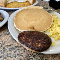 The Dakotan Restaurant - Pancake Platter: 2 Eggs, Meat of Choice (Sausage Patty) and 3 Pancakes